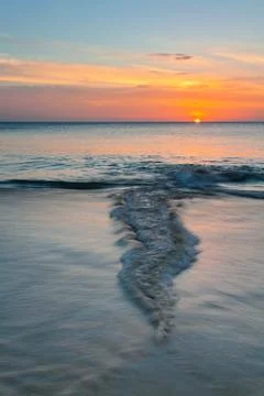 Tropical beach at sunset. Stock Photos