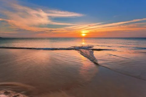 Tropical beach at sunset. Stock Photos