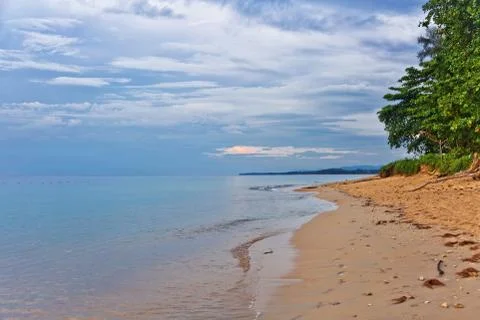 Tropical beach at sunset. Stock Photos