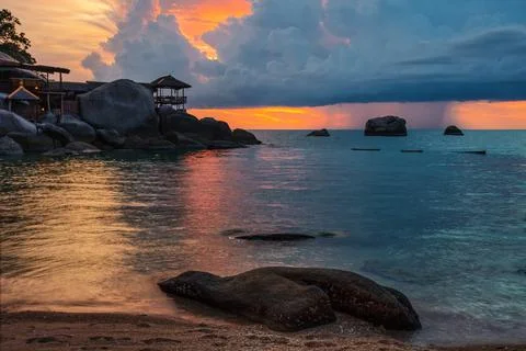 Tropical beach at sunset. Stock Photos