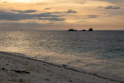 Tropical Beach at Sunset Stock Photos