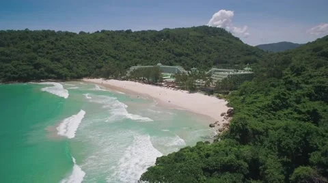 Tropical Beach Surrounded by Rainforest Covered Hills in Phuket Aerial Footage Stock Footage