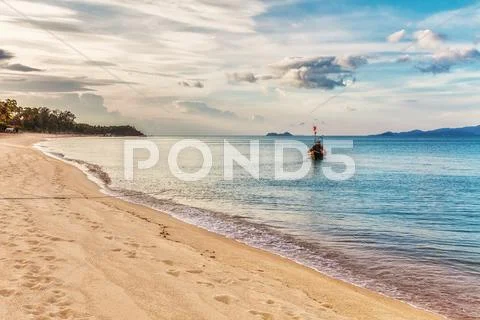 Tropical beach under gloomy sky Stock Photos