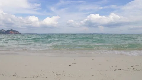 Tropical beach view of waves on white sand beach , Sea wave crashing on sand Stock Footage 146767707
