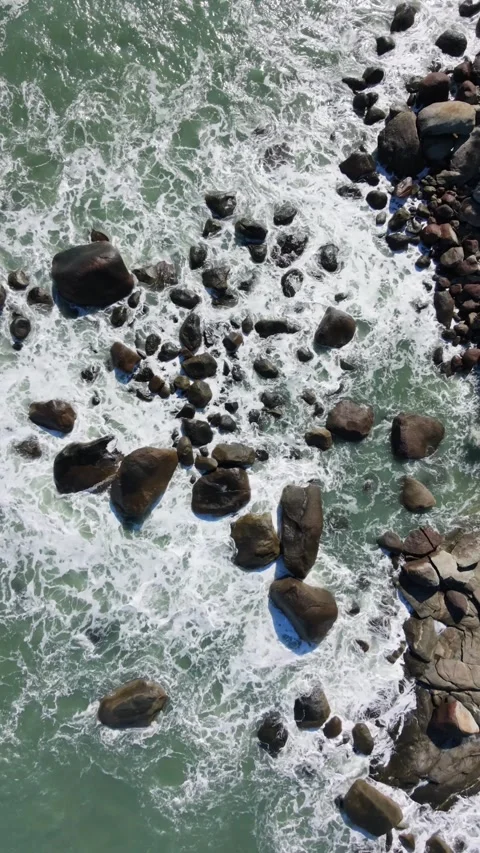 Tropical beach with waves hitting on the rocks at Brazil Stock Footage 336461660