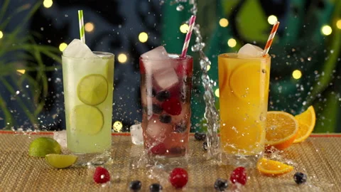 Tropical Beverages Splashed on Table Stock Footage 141533195