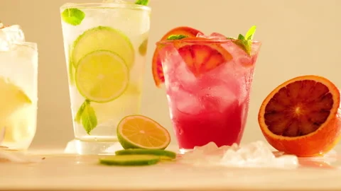 Tropical blended fruit smoothies. Pineapple, orange, coconut, lime, mint, ice Stock Footage 130744546