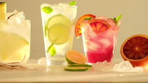 Tropical blended fruit smoothies. Pineapple, orange, coconut, lime, mint, ice Stock Footage 137623272