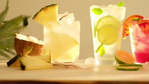 Tropical blended fruit smoothies. Pineapple, orange, coconut, lime, mint, ice Stock Footage 137623351
