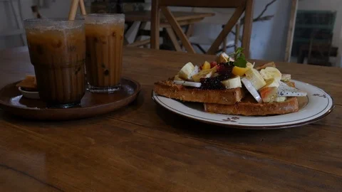 Tropical breakfast with cold coffee Stock Footage 101957594