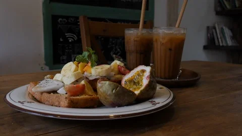 Tropical breakfast with cold coffee Stock Footage 102294447