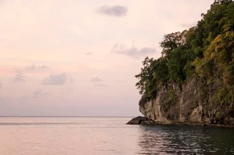 Tropical cliff going down in ocean Stock Photos