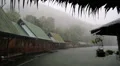 Tropical cloudburst on the Kwai river in Thailand. Raindrops fall from roof HD Footage
