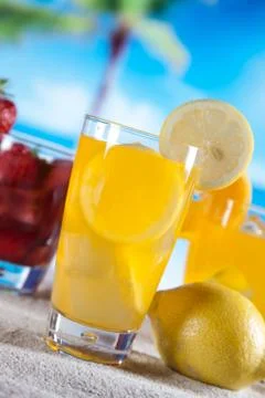 Tropical drinks on beach Stock Photos