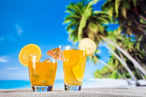 Tropical drinks on beach Stock Photos