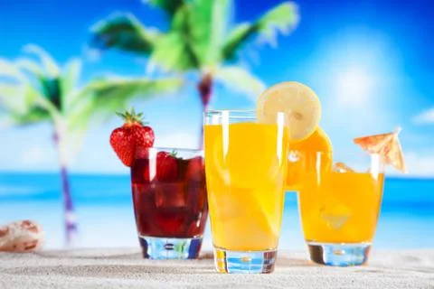 Tropical drinks on beach Stock Photos