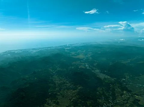 Tropical Forest Canopy Under Cloudy Skies - Drone View Stock Photos