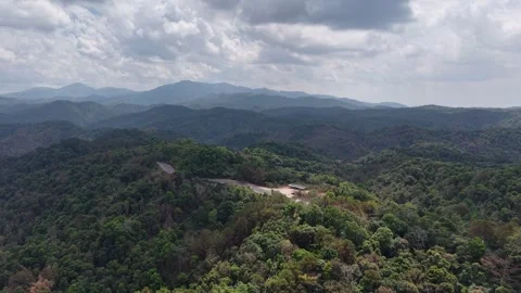 Tropical Forest Mountain Road with Cloudy Sky Stock Footage 329817932