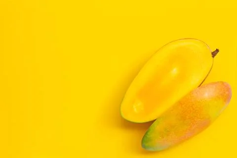 Tropical fruit, Mango  on yellow background. Copy space Stock Photos