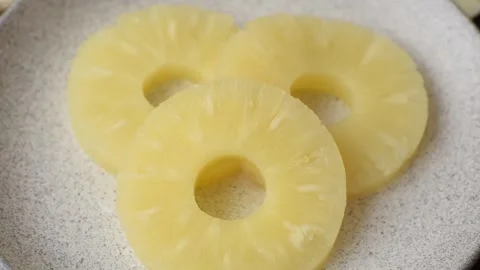 Tropical fruit pineapple in rings or slices tinned sweet Stock Footage 306474035