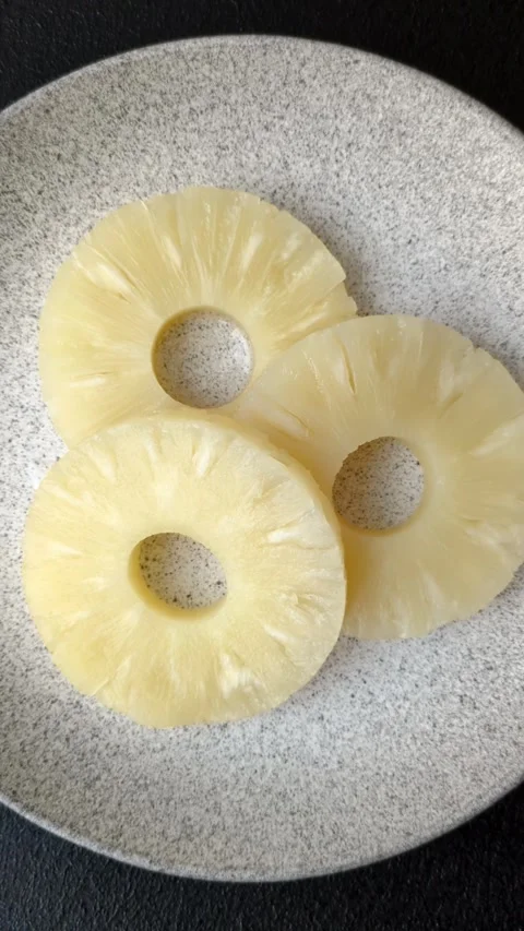 Tropical fruit pineapple in rings or slices tinned sweet Stock Footage 306474127