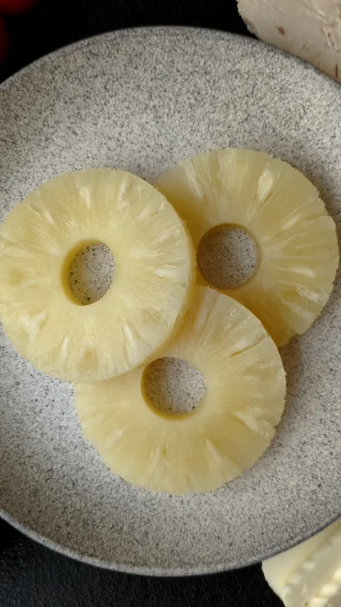 Tropical fruit pineapple in rings or slices tinned sweet Stock Footage 306474136