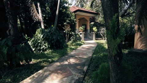 Tropical garden in a resort hotel, old villa in Thailand in a quiet location Stock Footage