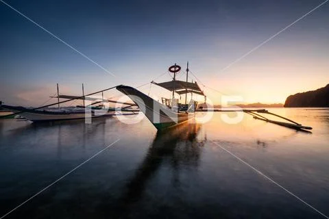 Tropical harbor bay in evening. Golden hour in lagoon in Philippines, Palawan Stock Photos
