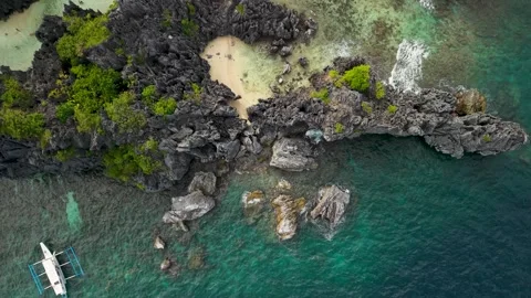 Tropical Hidden Beach Surrounded by Limestone Cliffs on Matinloc Island Video stock 344690314
