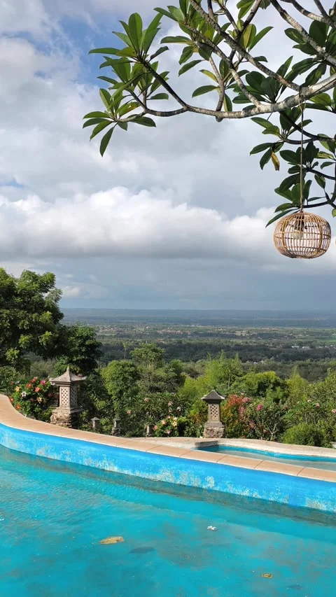 Tropical Infinity Pool Overlooking Lush Green Valley in Bali, Indonesia Stock Footage 340464688