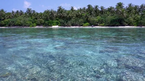 Tropical island at maldivian atoll in Indian Ocean Stock Footage