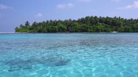 Tropical island at maldivian atoll in Indian Ocean Stock Footage