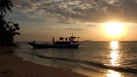 Tropical island sunset Stock Footage 99162004