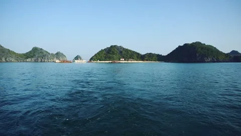 Tropical Islands Rising Dramatically Over Deep Blue Water in HaLong Bay Video stock 340028928