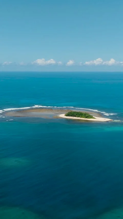 Tropical Islet surrounded by white sand in deep sea. Philippines. Stock Footage 253257016