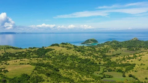 Tropical landscape, view from above. Large tropical island with green hills. Stock Footage 126522501