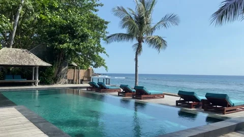 Tropical Luxury Infinity Pool and Ocean View at Beach Resort Stock Footage 340435453
