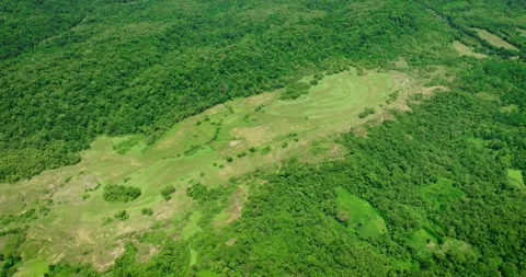 Tropical Mountain Meadow Under Clouds - Drone View Stock Footage 309313722