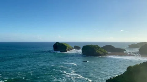 Tropical Ocean Cliffs and Small Islands at Pantai Kasap, Pacitan Stock Footage 335351506