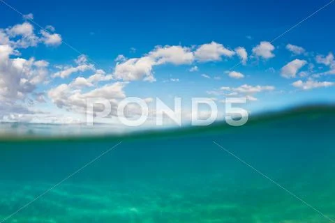 Tropical ocean under water with sky Stock Photos