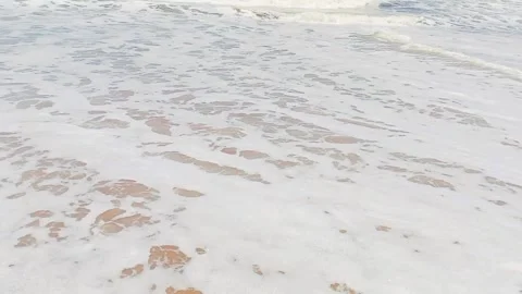 Tropical ocean waves crashing on sandy beach sunny day Stock Footage 346335900