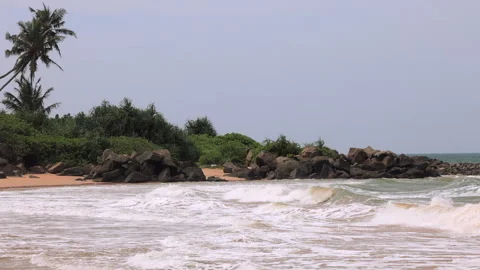 Tropical Ocean Waves on Sandy Beach with Palm Trees and Rocks: Relaxing Seascape Video stock 331821248