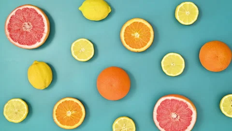 Tropical pattern with citrus fruits on vivid blue background. Stop motion Stock Footage 192510095