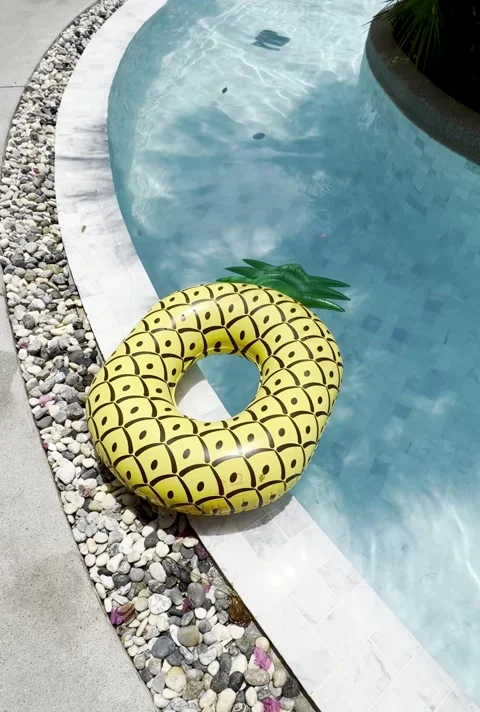 Tropical pool with pineapple float, perfect relaxation. Stock Footage 303470989