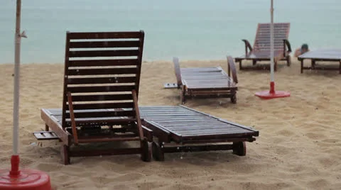 Tropical rain beach and deck chair 動画素材 23323117