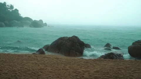 Tropical rain drops falling on beach in Thailand. Strong extreme cyclone Stock Footage 237745716