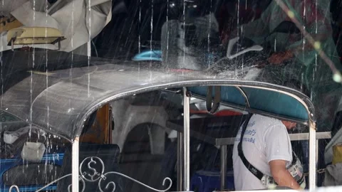 Tropical rain is falling on the stand of the taxi - motor tricycles Stock Footage 255386830