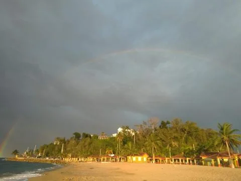 Tropical Rainbow on the Beach Stock Photos