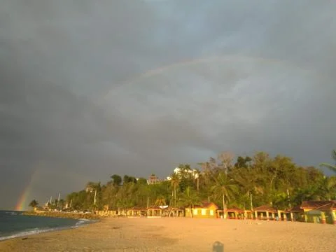 Tropical Rainbow on the Beach Stock Photos