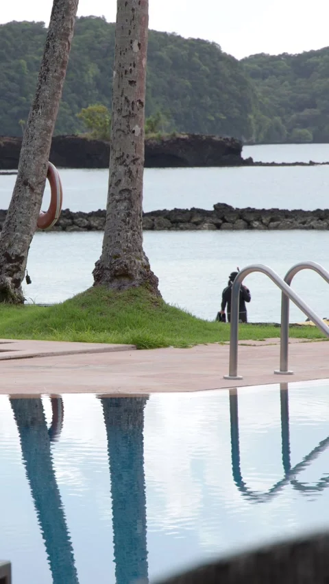 Tropical Resort Infinity Pool Overlooking Ocean and Islands in Palau Stock Footage 329262145